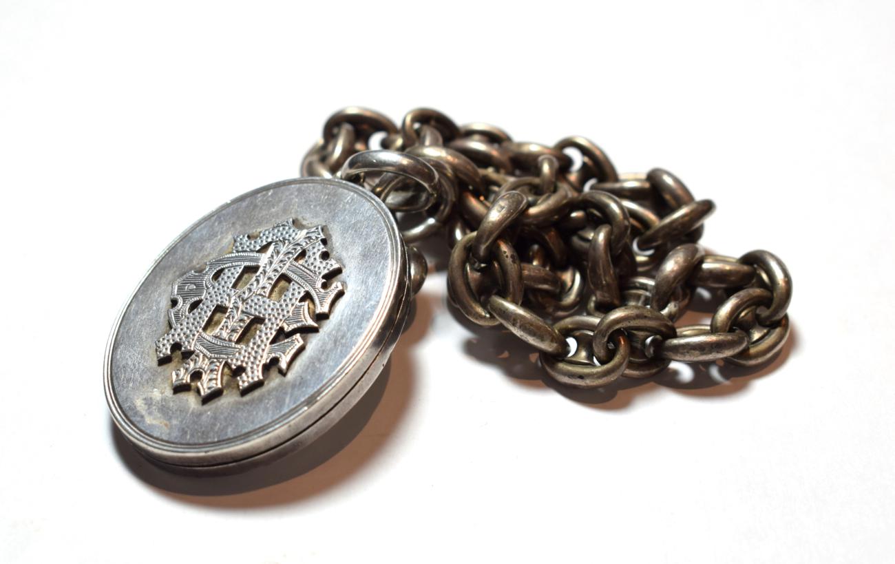 A Victorian locket on chain, locket measures 6.2cm by 4.0cm, chain length 46.5cm . Gross weight 64.6