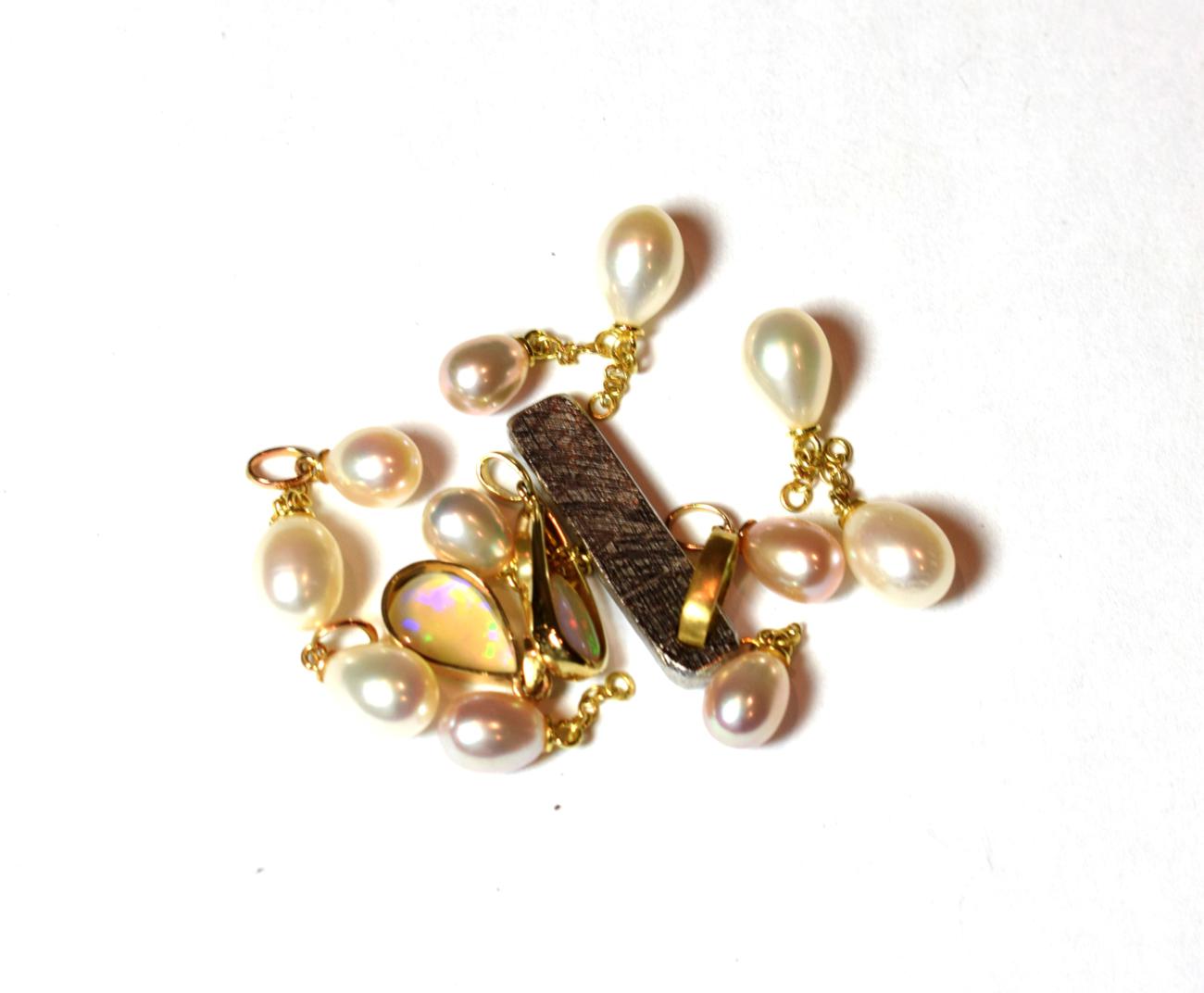 Eleven cultured pearl charms/pendants, unmarked; together with a 9 carat gold opal pendant, length