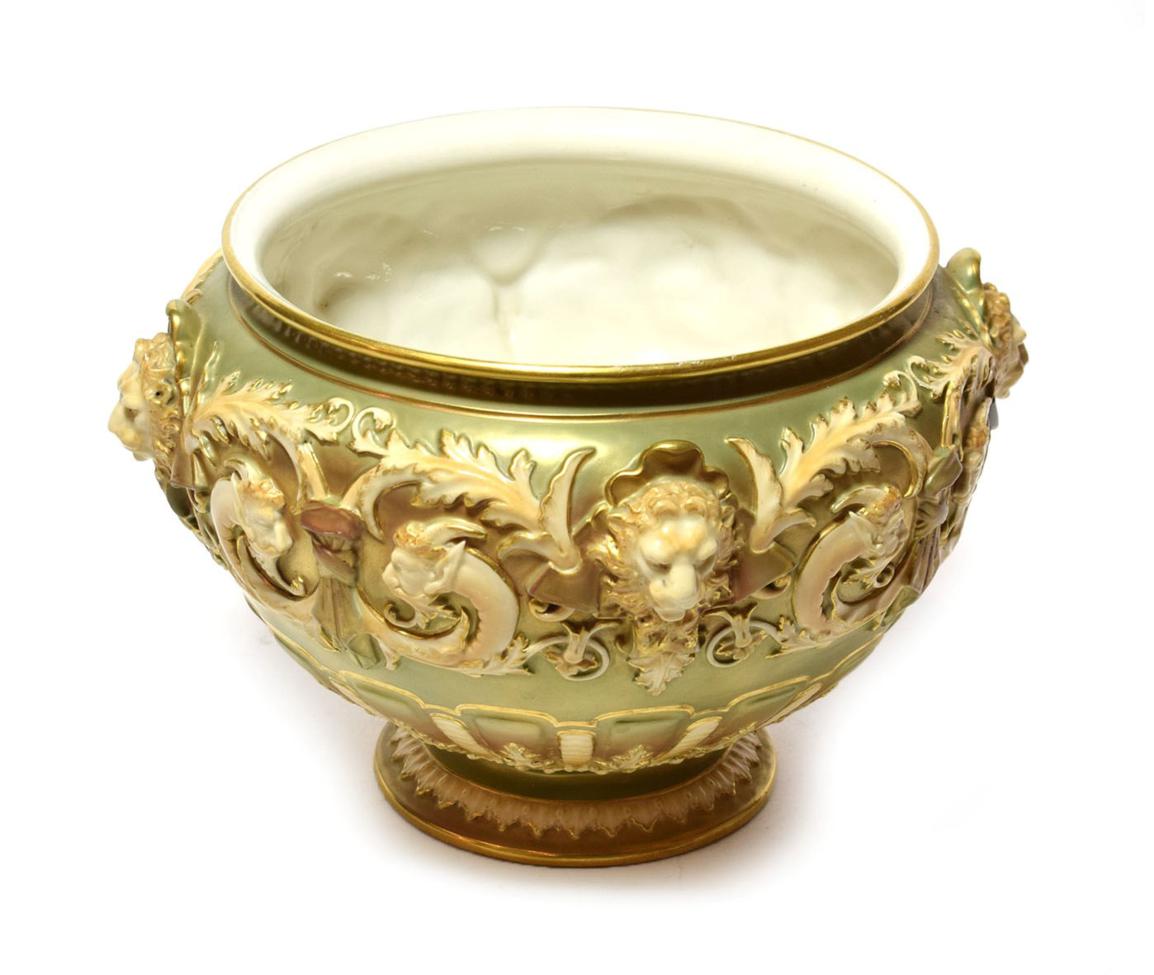 A rare Royal Worcester footed bowl, blush ivory and decorated with lion masks, shape number 1310,