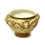 A rare Royal Worcester footed bowl, blush ivory and decorated with lion masks, shape number 1310,
