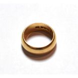 An 18 carat gold band ring, finger size V. The ring is hallmarked with sponsor's mark 'SH',