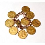 A charm bracelet stamped '9' and '.375' hung with nine full sovereigns dated 1915, 1908, 1974,