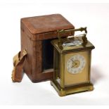 A brass carriage timepiece with travelling outer case