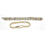 A three row cultured pearl bracelet with cultured pearl panels at intervals, the catch loop is