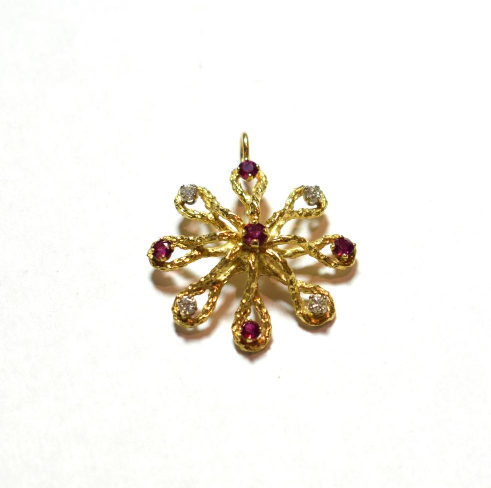 A ruby and diamond pendant, stamped '750', length 3.4cm . Gross weight 6.0 grams.