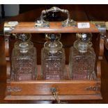 A silver plated three bottle tantalus