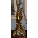 A early 20th century green onyx figural striking clock/lamp, now converted into a electric lamp
