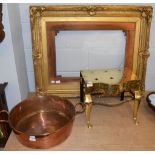 A 19th century brass trivet (footman); together with a large copper pan; and a gesso moulded picture