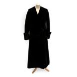 An Early 20th Century Black Evening Coat, with collar, fold back buttoned cuffs and two-button