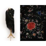 An Early 20th Century Chinese Black Silk Shawl, embroidered to the centre with four coral coloured