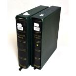 Two used and empty Stanley Gibbons leather bound stamp albums in slip cases.