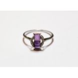 An Art Deco amethyst and diamond ring, finger size O1/2 NB: one diamond deficient . Gross weight 2.2