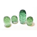 Four Victorian green glass dumps with bubbles, largest 18.5cm