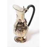 A Victorian silver ewer, by Joseph Rodgers and Sons, Sheffield, 1900, pear-shaped and on spreading