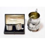 A Victorian silver christening-mug, by Robert Hennell, London, 1875, baluster and on spreading foot,