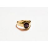 A 9 carat gold garnet solitaire ring, finger size U. Gross weight 4.5 grams.