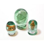 A large Victorian green glass dump with sulphide of Gladstone, ovoid with waisted base, 16cm;