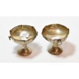 A pair of George V silver pedestal dishes, by William Hutton and Sons, Birmingham, 1913 and 1914,