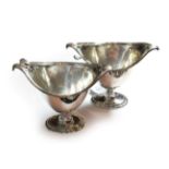 A pair of George V silver sauce-tureens and ladles, by Thomas Bradbury & Sons Ltd., Sheffield, 1926,