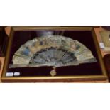 A circa 1860s white mother-of-pearl fan, the monture carved, pierced, gilded and silvered, the