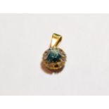 A blue topaz and diamond cluster pendant, length 1.9cm NB: one diamond loose but present . Unmarked.