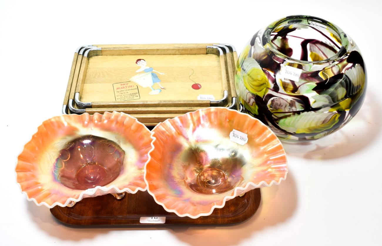 A graduated set of three cocktail trays in the Art Deco style; two carnival glass dishes; and a