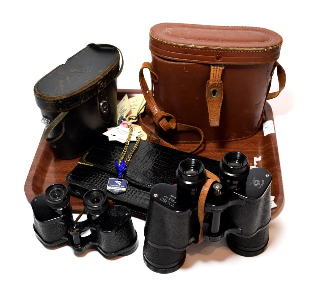 Two pairs of cased field binoculars; and a hand bag with race day badges