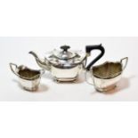 A three-piece Edward VII silver tea service, by John Gilbert, Birmingham, 1906, each piece on