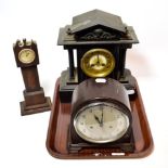 An early 20th century black slate mantel clock; together with an early 20th century Bakelite cased