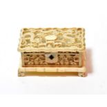 A late 19th century Chinese Export ivory casket, pierced hinged lid with dragon design, pierced