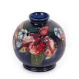 Walter Moorcroft (1917-2002): An Orchid and Spring Flowers Pattern Vase, impressed factory marks