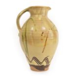 Clive Bowen (b.1943): A Red Earthenware Harvest Jug, wood-fired slip decorated with combing and