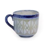 A Martin Brothers Stoneware Cup, decorated with a repeating pattern, between blue bands and