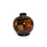 William Moorcroft (1872-1945): A Flambé Leaf and Blackberry Pattern Vase, impressed MADE IN