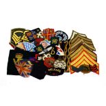 A Collection of Approximately Fifty Embroidered Cloth Insignia, including formation patches, rank