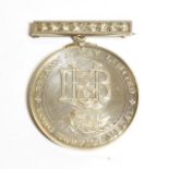A Bryant & May Ltd. Long Service Silver Medal, the obverse with B & M monogram above an ark marked