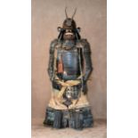 A Japanese Edo Suit of Armour, 1603-1868, comprising a five plate brown lacquered iron Zunari kabuto