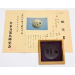 A Japanese Iron Maru Gata Tsuba, with ko-sukashi of a sakura flower, signed, 7.1cm, in wood box with