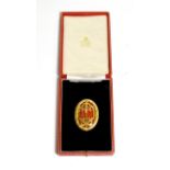 A Knight Bachelor's Badge, in silver gilt and red enamel, hallmarks for London 1957, in case of