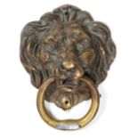 A Late 18th Century Brass Lion Mask and Ring Door Knocker, the ring set with a later silver coloured
