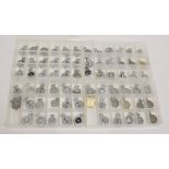 A Collection of Seventy Elizabeth II British Police Cap Badges, in chrome and white metal, including