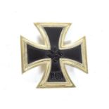 A German Third Reich Iron Cross, first class, with vertical sword shape pin