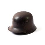A First World War German M1916 Helmet (Stahlhelm), with traces of painted camouflage, with three