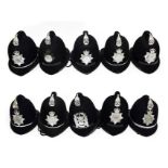 Nine Elizabeth II Police Custodian Coxcomb Helmets, with chrome coxcombs and helmet plates to:- West