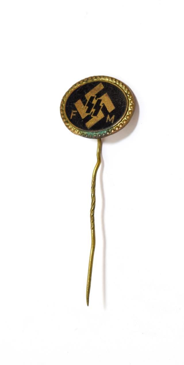 A German SS Supporting Member's Stick Pin, the oval black enamel panel with SS runes backed by a