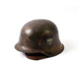 A German Third Reich M42 Single Decal Steel Helmet, with camouflaged finish of splashes of brown