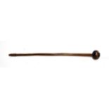 An Early 20th Century Zulu Knobkerrie, of hard wood with deep chestnut coloured patina, the