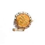 An Edward VII 1909 half sovereign loose mounted as a brooch . Brooch mount stamped '9C'. Gross