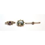 An aquamarine and seed pearl brooch, length 3.5cm; an amethyst and seed pearl brooch, stamped '9CT',