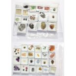 A quantity of loose gemstones including amethyst, tiger's-eye, rock crystal with needle like